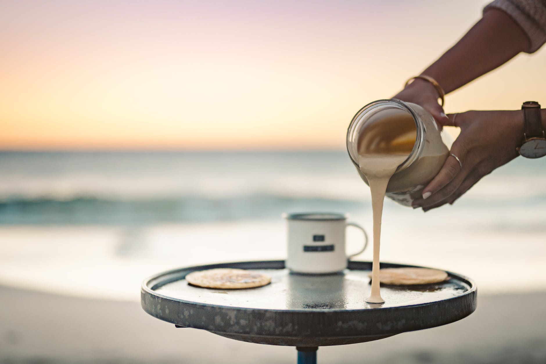 person cooking pancakes